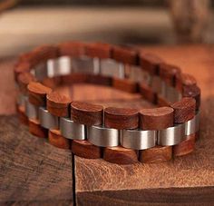 Product Description This unique design wood bracelet features real (Reclaimed) zebra wood with metal accents which results in a stunning, one of a kind, lightweight men’s bracelet. Each wood bracelet is naturally alluring and hand crafted without the use of harsh chemicals. Dimensions: Perimeter: 7.4" (188 mm) Band Width: 0.6" (15.5 mm) Item Weight: 1.4 oz (39 g) Product Specifications Bracelets Type: Chain & Link BraceletsMetals Type: Stainless SteelClasp Type: Hidden-safety-claspStyle: Cla Natural Wood Bracelet, Natural Wood Bracelet As A Gift, Natural Wood Bracelet Jewelry Gift, Wooden Jewellery, S Bracelet, Wooden Bangle, Wooden Bracelet, Wood Bracelet, Wood Burning Art