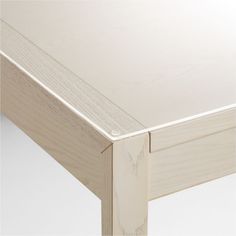 a close up view of the top of a bed frame with no sheets on it