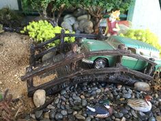 a toy car that is sitting on some rocks