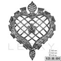 an ornate heart shaped metal object on a white background