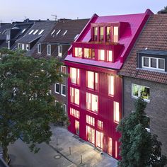 a red building with lots of windows on top of it