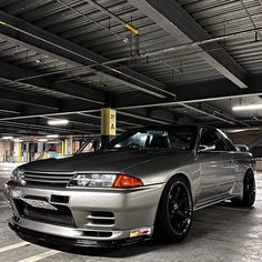 a silver car parked in a parking garage