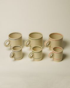 several cups are stacked on top of each other