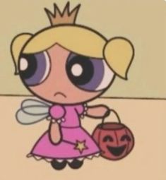 a cartoon character holding a pumpkin and wearing a crown