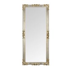 a white and gold framed mirror on a wall with an ornate border around the edge