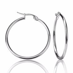 Classic silver hoop earrings. .: trendy hoop earrings.: sizes vary.: stainless steel Ready-to-Wear items are ship in approximately 7 business days. All jewelry is ship in a craft colored jewelry gift box ready for gift-giving. Have questions? See our FAQ section. If you need further assistance, please message us at customercare@alquimajewelry.com. Bracelet Viking, Hoop Earrings Style, Big Hoop Earrings, Free Earrings, Round Circle, Party Earrings, Large Hoop Earrings, Earring Sale, Fashion Jewelry Earrings