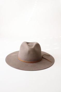 Add a dash of vintage charm to your wardrobe with The Beverly Rancher Hat. Made of high-quality wool felt in a warm khaki color, this hat is perfect for keeping your head stylishly warm during chilly days. Embrace the rancher lifestyle with this playful and quirky accessory. Yee-haw! Approx.3.8" Teardrop Crown3.5" Flat Brim Made of:100% Wool Felt Made In EcuadorFirm/Stiff BodySuede Hat BandCotton SweatbandWater RepellentSatin Lined Felt Hats For Women, Suede Hat, Rancher Hat, Yee Haw, Felt Hat, Khaki Color, Wool Hat, Custom Hats, Your Head