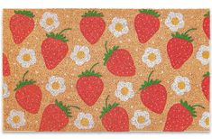 a door mat with strawberries and daisies on the outside, in front of an orange background