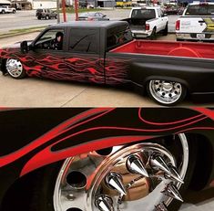 the truck is painted red and black with flames on it's sides, while the other side has chrome rims