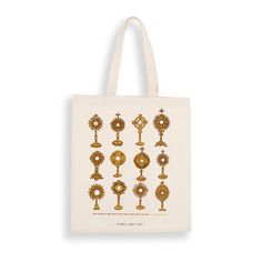 a tote bag with gold designs on it