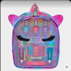 the unicorn makeup bag is filled with cosmetics