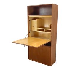 a wooden desk with an open drawer on the top and bottom shelf above it, against a white background