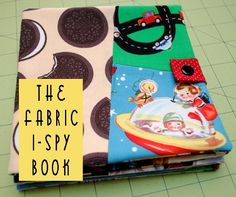 the fabric i - spy book is sitting on a cutting board