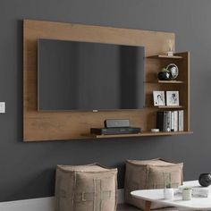 a wall mounted entertainment center in a living room