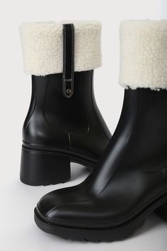 Add a dose of cozy to those chilly, cold weather days with the Lulus Chayy Black Faux Fur Mid-Calf Boots! These rubber boots feature a square toe upper and a mid-calf shaft with a 7.25"" zipper at the instep, all atop a block heel. Fuzzy faux fur trim and a unique stitched detail complete the look. 2. 5"rubber block heel. Cushioned insole. Rubber sole has nonskid markings. All Man Made Materials. Imported. Lulus | Chayy Black Faux Fur Mid-Calf High Heel Boots | Size 7. Black Winter Boots, Lulu Fashion, Rubber Boots, Black Faux Fur, Calf Boots, Heel Boots, Mid Calf Boots, High Heel Boots, Fur Trim