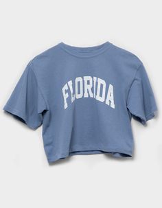 Full Tilt Florida Crop Boyfriend Tee. Florids Screened Across Center Chest. Ribbed Crew Neckline. Short Sleeve. Contrast Stitching. Cropped And Boxy Fit. 100% Cotton. Machine Wash. Imported. | Full Tilt Florida Girls Crop Boyfriend Tee Basic Blue Slogan Tops, Basic Blue Tops With Slogan, Spring College Tops With Text Print, Blue Letter Print Cropped T-shirt For Spring, Trendy Cotton Tops For College, Spring Blue Cropped T-shirt With Letter Print, Summer College Tops Soft-washed, Blue Cropped T-shirt With Letter Print For Spring, Soft-washed Summer Tops For College