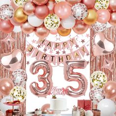 an image of a birthday party with balloons and presents on the table for someone's 35th birthday