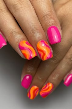 These vibrant, almond-shaped nails are the epitome of playful summer vibes. A vivid pink polish covers some nails, providing a bold, monochromatic look. The others boast a swirling marble design, blending hot pink, zesty orange, and a touch of soft yellow to create an eye-catching, tropical effect. This manicure is perfect for anyone looking to add an energetic splash of color to their style.  // Photo Credit: Instagram @amyhendersonmua Orang And Pink Nail, Neon Nails Pink And Orange, Marble Nail Designs Summer, Swirl Manicure, Orange Pink Nails, Pink Orange Nails