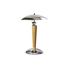 a lamp that is sitting on top of a metal stand with a wooden pole in front of it