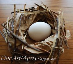 an egg in a nest made out of twigs