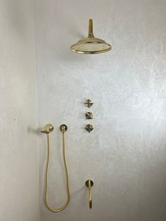 the shower head and hand shower are brass