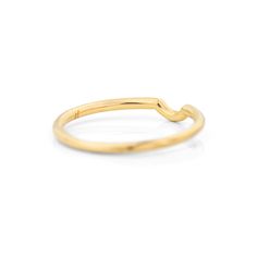 a yellow gold ring with curved edges on a white background, the band has been made from