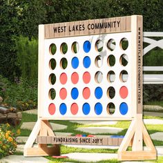 a giant board game sitting in the middle of a garden