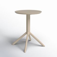 a white table with three legs and a round top on an isolated surface, viewed from the front