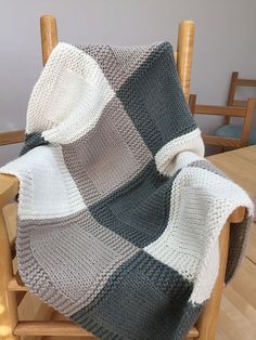 a blanket that is sitting on top of a chair