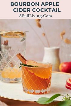 the bourbon apple cider cocktail is served on a tray