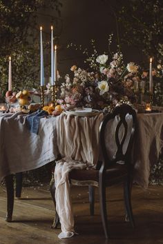 the table is set with candles and flowers