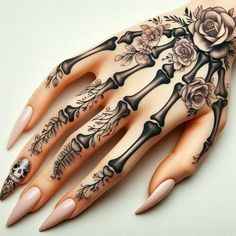 a woman's hand with tattoos and flowers on it