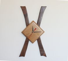 a clock made out of wooden sticks and wood