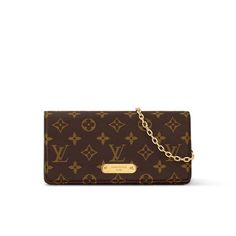 a brown louis vuitton wallet with gold hardware and chain on the front,