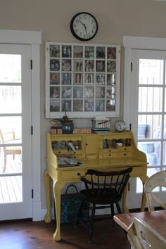 a yellow piano sitting in the middle of a living room next to a table and chairs