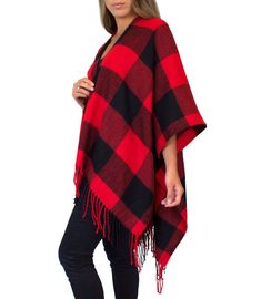 "This cozy chic knit poncho features a bold plaid print with fringe trim, and lightweight, flowing material that is comfortable and warm. Wear with your favorite boots for a stylish, yet casual look on chilly days. Material: 100% Acrylic Sizing: One size fits all Garment Measurements: 46\" x 55\" Model Measurements: Bust: 32\" Waist: 26\" Hips: 36\" Height: 5'5 We are taking steps towards sustainability! Your order will be packaged in tissue paper made from recycled materials and a biodegradable Plaid Shawl, Shawl Sweater, Plaid Poncho, Poncho Wrap, Plaid Cardigan, Buffalo Check Plaid, Ladies Poncho, Women Shawl, Wrap Cardigan