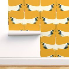 the wallpaper is designed with an image of birds in yellow and white, as well as two different colors