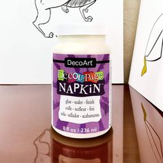 a bottle of decoart's deco - rapp napkin paint sitting on a table