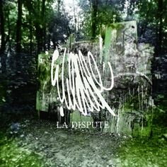 the words la dispute are written in white ink on a grungy background