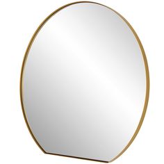 a round mirror with a gold frame on the top and bottom half, in front of a white background