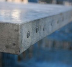 an image of a wooden table that is in the water