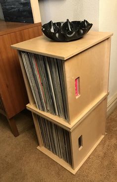 a record player on top of a wooden shelf