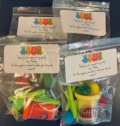 three plastic bags filled with different types of toys and labels on the back of them