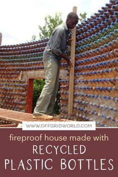 a man standing on top of a pile of plastic bottles with the words fireproof house made with recycled plastic bottles