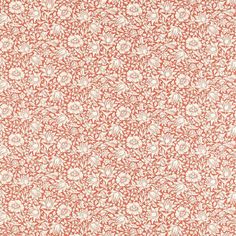 an orange and white floral pattern on fabric