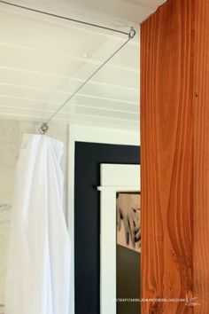 a towel hanging on a clothes line next to a door