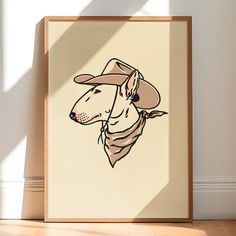 a drawing of a dog wearing a cowboy hat on a beige background in a wooden frame