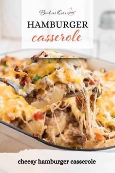 a casserole dish with cheese, hamburger and other toppings is being lifted from the casserole