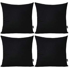 four black pillows sitting on top of each other