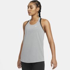 The Nike Dri-Fit Tank Is A Breathable, Flexible Layer That Helps Keep You Cool And Moving Naturally From Your First Stretch Well Into The Afterburn. Its Lightweight Fabric Is Made With At Least 75% Recycled Polyester. This Product Is Made With 100% Recycled Polyester Fibers. Shown: Smoke Grey/Heather/White Style: Da0370-084 Vest Tops Women, Nike Pro Women, Running Tank Tops, Sport Top, Nike Training, Nike Tops, Nike Dri Fit, Womens Vest, Dri Fit